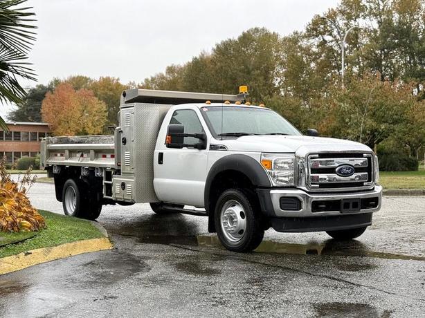 2015 Ford F-450 11-Foot Dump Truck with Storage Compartments and Beacon image 1