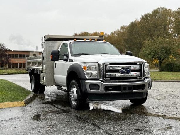 2015 Ford F-450 11-Foot Dump Truck with Storage Compartments and Beacon image 2