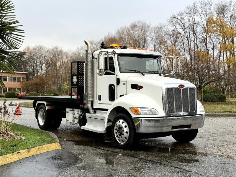 2020 Peterbilt 330 16-Foot Flat Deck Roll-Off Hook Truck display photo