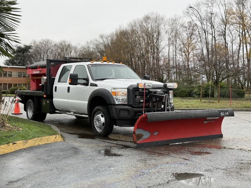 2013 Ford F-550 Crew Cab 9-Foot Flat Deck Dump Truck with Plow and Sander display photo