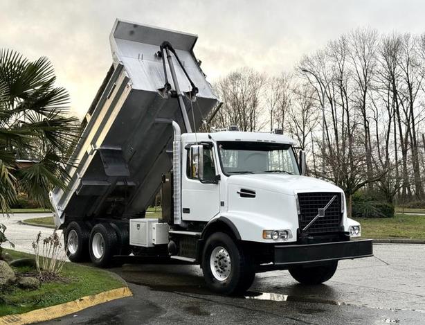 2009 Volvo VHD 6x4 Diesel Tandem Dump Truck with 16-Foot Box and 18-Speed image 1