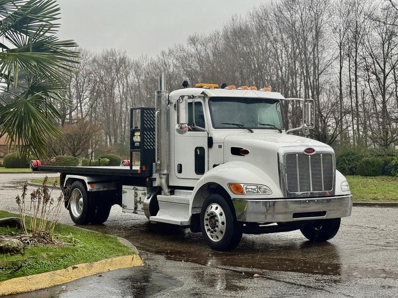 2020 Peterbilt 330 Hook Truck with 16-Foot Roll-Off Deck display photo
