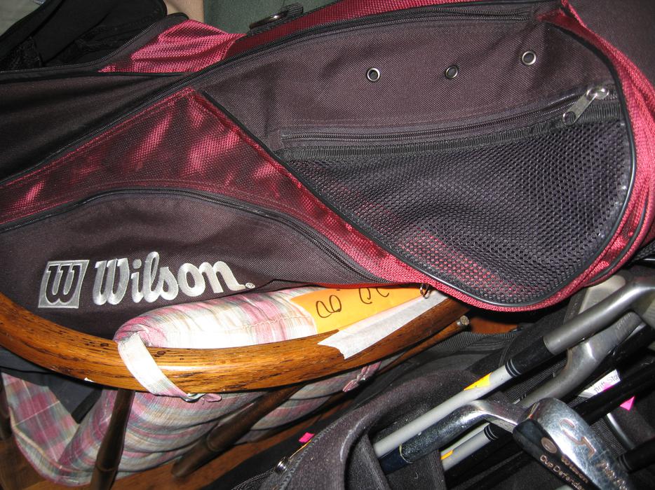 golf clubs and bags display photo