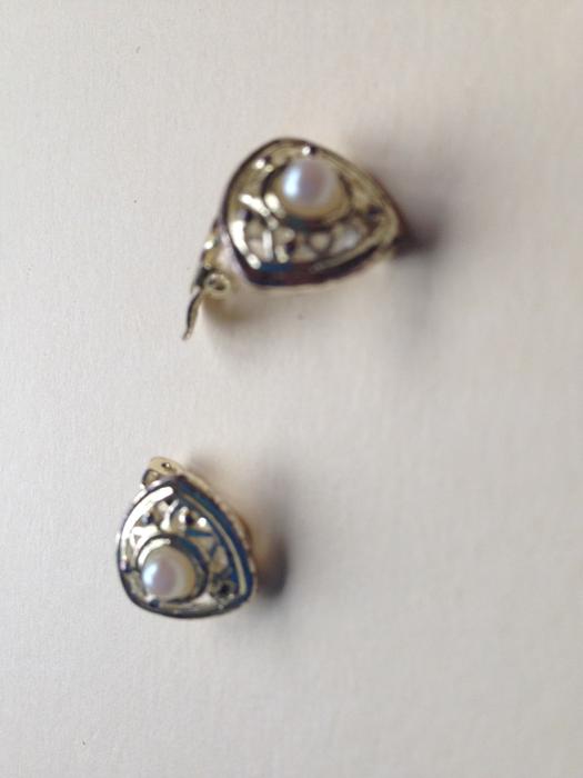 Silver plated pearl clip on earrings display photo