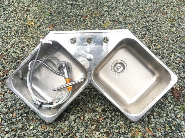 Stainless Steel Corner Sink with a New Faucet  and plumbing. image 1
