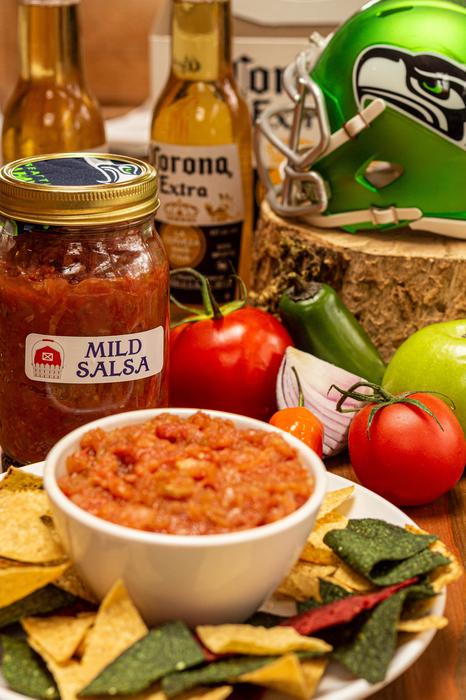 Homemade jams, salsa, chutney and antipasto display photo