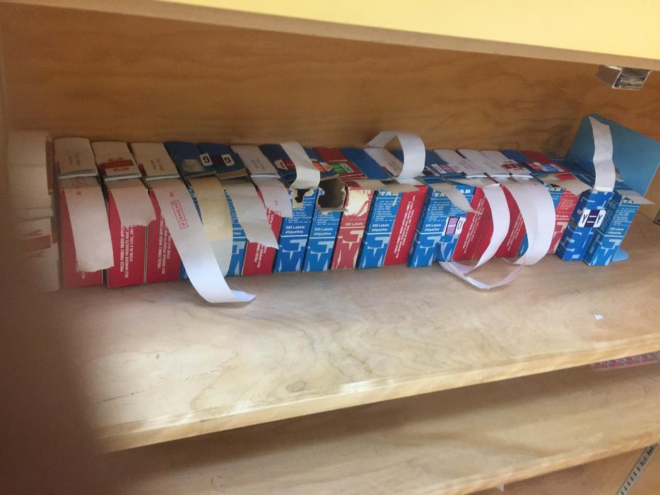 Letters and number tapes for filing. display photo