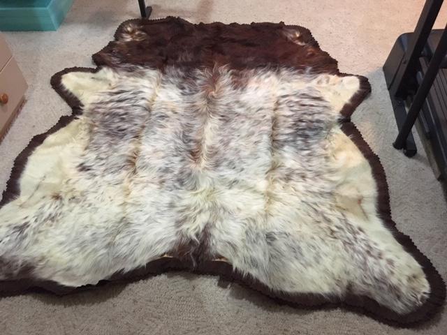 COW HIDE RUG display photo