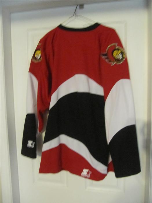 Vintage Ottawa Senators Starter Jersey SIGNED by Wade Redden. display photo